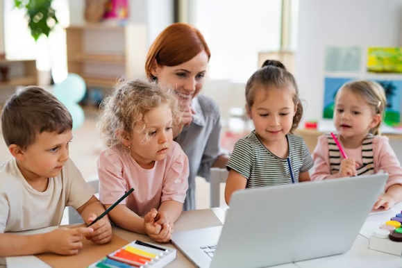 Children are using the computer to play.